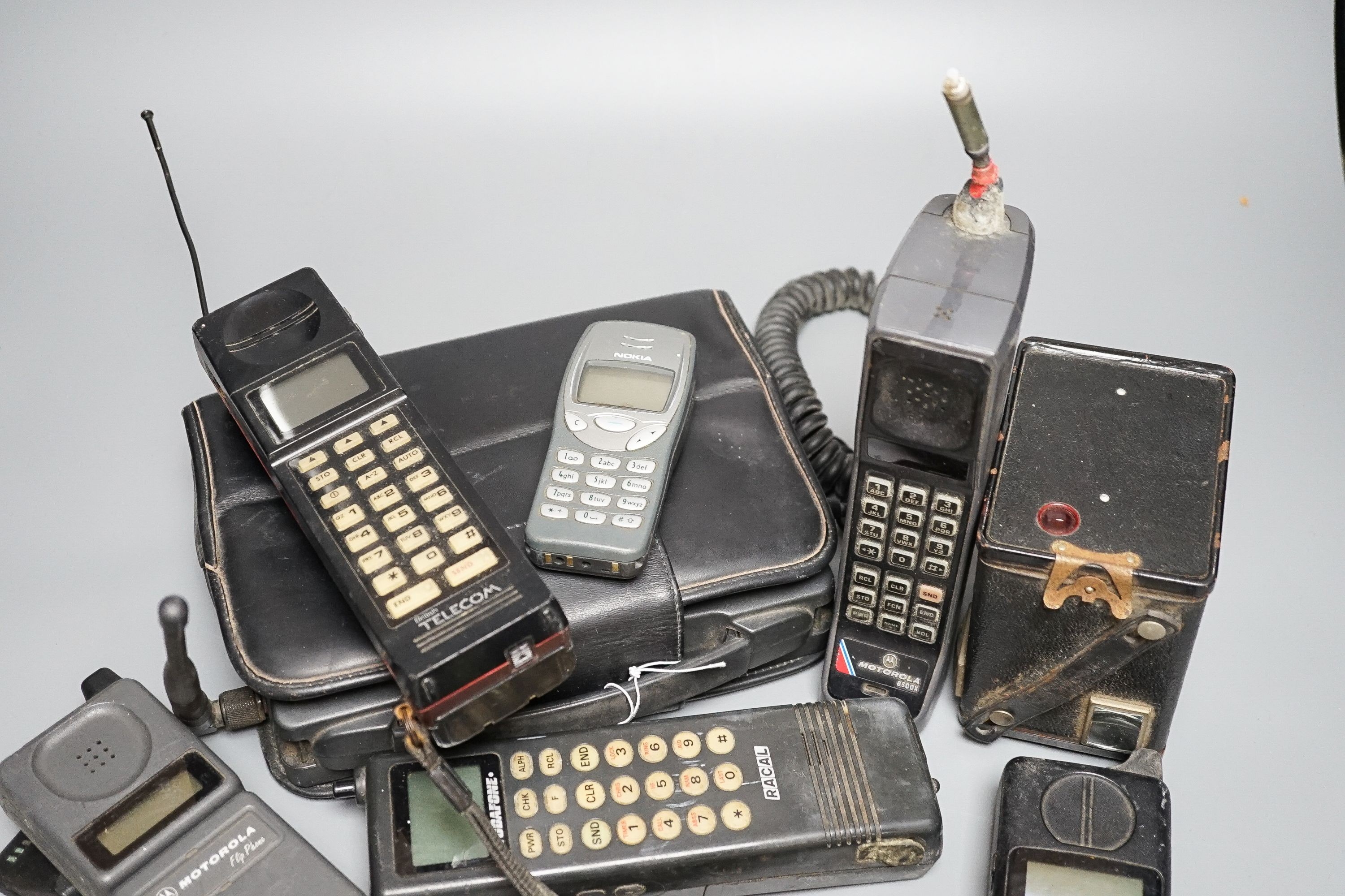 Eight early/retro mobile phones and a Box Brownie